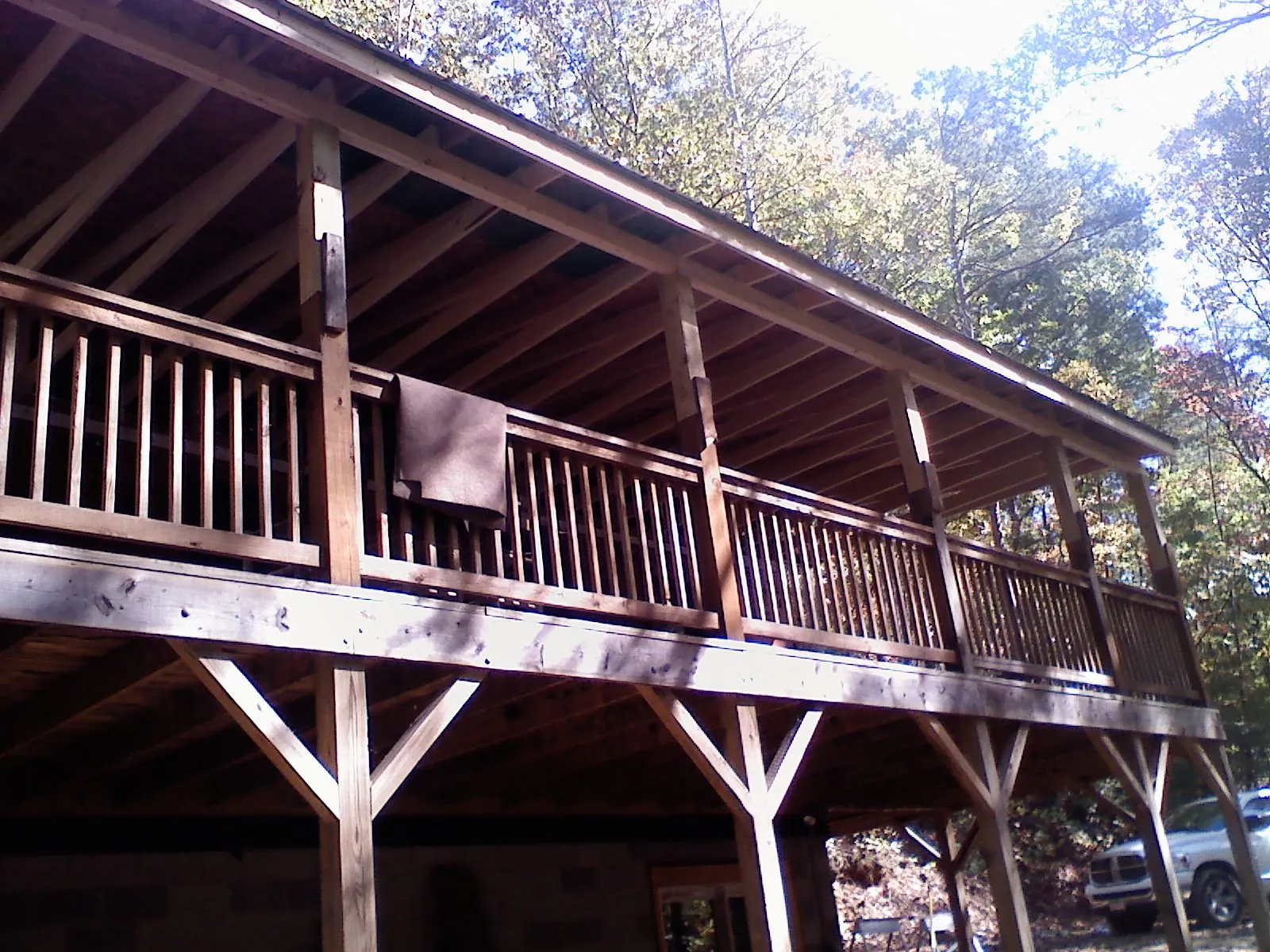 Timber framing under a new elevated porch and deck — Roof Leak Repair in Portage by Roofing Brothers